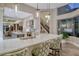 Gourmet kitchen features a large island, stainless steel appliances, and ample counter space at 3580 Fair Oaks Ln, Longboat Key, FL 34228