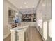 Spacious kitchen with marble island, custom cabinetry, and stainless steel appliances at 3580 Fair Oaks Ln, Longboat Key, FL 34228