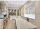 Expansive kitchen with marble island, professional appliances, and plenty of storage space at 3580 Fair Oaks Ln, Longboat Key, FL 34228