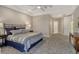 Spacious main bedroom with tray ceiling, carpeted floor and ensuite access at 3580 Fair Oaks Ln, Longboat Key, FL 34228