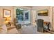 Bright office with sliding glass doors leading to the outdoor space, offering a serene workspace at 3580 Fair Oaks Ln, Longboat Key, FL 34228