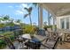 Charming covered patio with waterfront views, perfect for outdoor dining and entertaining at 3580 Fair Oaks Ln, Longboat Key, FL 34228