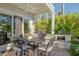 Relaxing patio area with built-in grill and lush landscaping, ideal for outdoor cooking at 3580 Fair Oaks Ln, Longboat Key, FL 34228
