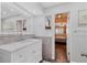 Modern bathroom with a marble vanity and a view of the bedroom at 3611 99Th W St, Bradenton, FL 34210