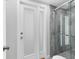 Bathroom with a walk-in shower and frosted glass door at 3611 99Th W St, Bradenton, FL 34210