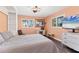 Guest bedroom with a comfortable bed and built-in shelving at 3611 99Th W St, Bradenton, FL 34210