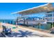 Covered boat lift with a boat in a waterfront community at 3611 99Th W St, Bradenton, FL 34210