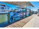 Covered boat lift with a large boat in a canal at 3611 99Th W St, Bradenton, FL 34210