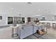 Open concept living room with gray sectional and access to patio at 3611 99Th W St, Bradenton, FL 34210