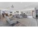 Open floor plan living area with a sectional sofa and views into the kitchen and dining area at 3611 99Th W St, Bradenton, FL 34210