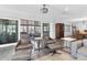 Relaxing living area featuring leather armchairs, a view to the patio, and hardwood floors at 3611 99Th W St, Bradenton, FL 34210