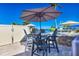 Outdoor patio with seating area, umbrella, and waterfront view at 3611 99Th W St, Bradenton, FL 34210