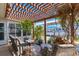 Covered patio with seating area and lush landscaping at 3611 99Th W St, Bradenton, FL 34210