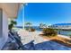 Waterfront patio with chairs and view of the water at 3611 99Th W St, Bradenton, FL 34210
