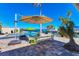 Pool area with patio furniture and umbrella at 3611 99Th W St, Bradenton, FL 34210