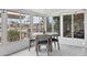 Bright sunroom with water views and dining area at 3611 99Th W St, Bradenton, FL 34210