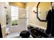 Modern bathroom with black vanity and walk-in shower at 3649 Wilderness W Blvd, Parrish, FL 34219