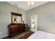 Bright bedroom with a dresser and en-suite bathroom access at 3649 Wilderness W Blvd, Parrish, FL 34219