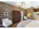 Bright bedroom with king bed and access to bathroom and closet at 3649 Wilderness W Blvd, Parrish, FL 34219