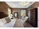 Large bedroom with king bed, private balcony, and walk-in closet at 3649 Wilderness W Blvd, Parrish, FL 34219
