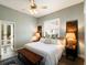 Spacious bedroom with king-size bed and access to private patio at 3649 Wilderness W Blvd, Parrish, FL 34219