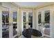Casual breakfast nook with French doors leading to the pool area at 3649 Wilderness W Blvd, Parrish, FL 34219