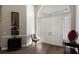 Elegant entryway with hardwood floors and a view to the living room at 3649 Wilderness W Blvd, Parrish, FL 34219