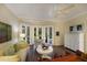 Bright Gathering room with hardwood floors, bay window and access to backyard at 3649 Wilderness W Blvd, Parrish, FL 34219