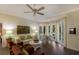 Relaxing Gathering room with hardwood floors, built-in cabinetry, and access to patio at 3649 Wilderness W Blvd, Parrish, FL 34219