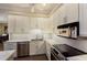 Modern kitchen with stainless steel appliances and white cabinets at 3649 Wilderness W Blvd, Parrish, FL 34219