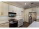 Updated kitchen with stainless steel appliances and white cabinets at 3649 Wilderness W Blvd, Parrish, FL 34219