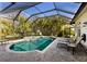 Inviting screened pool and spa with ample lounge space at 3649 Wilderness W Blvd, Parrish, FL 34219