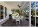 Relaxing screened patio with seating area and outdoor grill at 3649 Wilderness W Blvd, Parrish, FL 34219