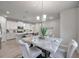 Elegant dining area with marble table and modern lighting at 3747 Laughing Dove Ave, Sun City Center, FL 33573