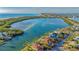 Stunning aerial view showcasing the waterfront property with a private pool, dock, and serene coastal ambiance at 400 N Washington Dr, Sarasota, FL 34236