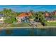 Waterfront home boasts a private pool, lush landscaping, and boat dock for premier waterfront living at 400 N Washington Dr, Sarasota, FL 34236