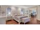 Main bedroom suite with wood floors, a sitting area and access to the bathroom at 400 N Washington Dr, Sarasota, FL 34236