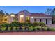 Beautiful single-Gathering home with a red tile roof, manicured landscaping, and a two-car garage at 400 N Washington Dr, Sarasota, FL 34236