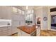 Gourmet kitchen island with a butcher block top, and custom cabinets at 400 N Washington Dr, Sarasota, FL 34236