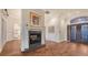 Cozy living room with a fireplace and views to the gourmet kitchen at 400 N Washington Dr, Sarasota, FL 34236