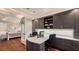 Ensuite office features custom shelving, desk, and cabinetry with views into the bedroom at 400 N Washington Dr, Sarasota, FL 34236