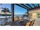 Outdoor patio with waterfront views, comfortable seating, and a covered pergola at 400 N Washington Dr, Sarasota, FL 34236
