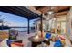 Cozy covered patio with comfortable seating, a fireplace, and scenic waterfront views at 400 N Washington Dr, Sarasota, FL 34236