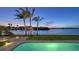 Backyard pool with a view of the waterfront and sky at dusk at 400 N Washington Dr, Sarasota, FL 34236