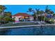Beautiful waterfront property featuring a backyard pool, lush landscaping, and direct access to the water at 400 N Washington Dr, Sarasota, FL 34236