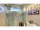 The walk-in shower is spacious and features glass doors, tile surround, and a window at 400 N Washington Dr, Sarasota, FL 34236