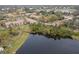 Aerial view of community with lake and walking paths at 4001 Crockers Lake Blvd # 11, Sarasota, FL 34238
