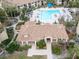 Community pool and adjacent clubhouse at 4001 Crockers Lake Blvd # 11, Sarasota, FL 34238