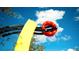 Modern abstract sculpture with yellow, red and black elements at 4010 18Th W Ave, Bradenton, FL 34205