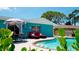 Inviting backyard oasis with a refreshing pool, lounge chairs, and patio seating at 4010 18Th W Ave, Bradenton, FL 34205